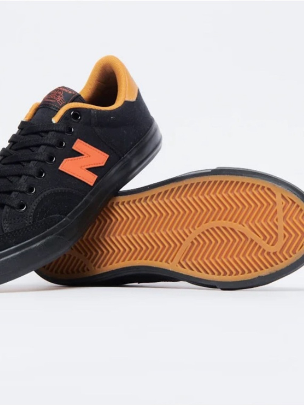 New Balance Black Sneakers with Orange Accents